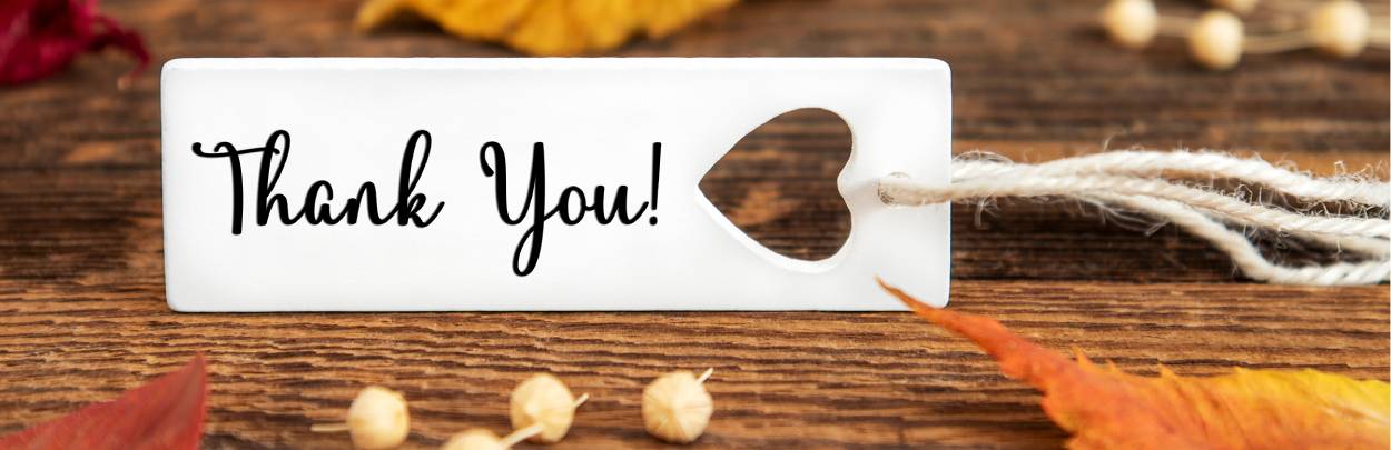 A small white tag with "Thank you" written on it
