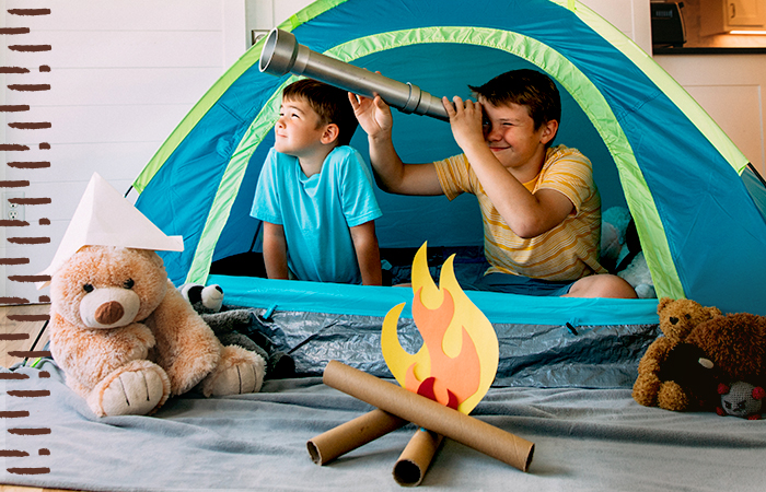 Two young kids in a tent