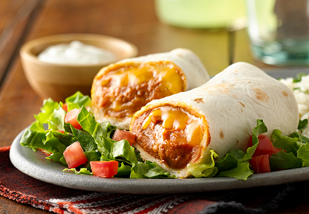 Classic Bean and Cheese Burritos on a plate with lettuce