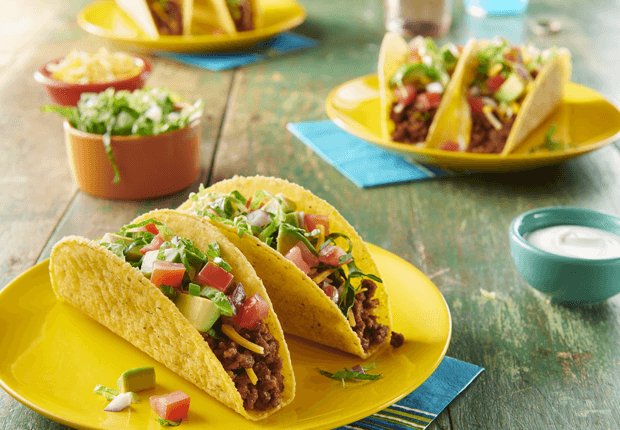 Quick and Easy Beef Tacos on a plate with toppings