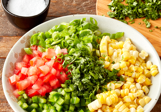 Corn, diced tomatoes, sliced green onion and minced jalapeno in a large bowl and salt in a small bowl